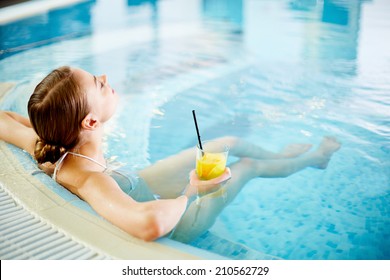 Woman enjoying in swimming pool after procedures