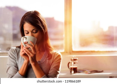 Woman Enjoys Fresh Coffee In The Morning With Sunrise At Home Lifestyle