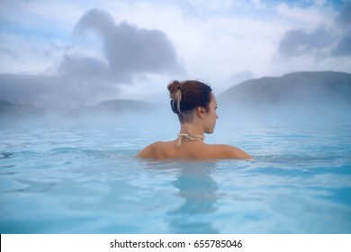 Woman Enjoys Spa In Geothermal Hot Spring