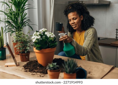 Woman enjoys taking care of her plants