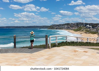 A Woman Enjoys The View Of Bar Beach - Merewether In Newcastle Australia. Bather's Way Is A Newly Developed Coast Walk In Australia's Second Oldest City A Few Hours Drive North From Sydney.