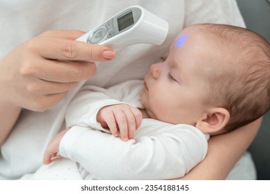 Woman ensures baby's wellness with tech. Concept of modern motherhood and health precautions