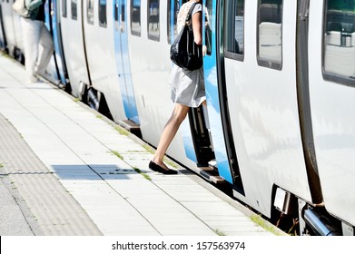 Woman enters train