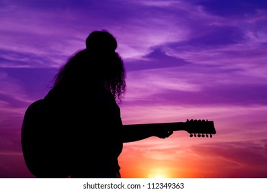 Woman In The Evening With Gitar