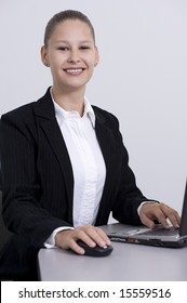 Woman Executive With Brown Pulled Back Hair