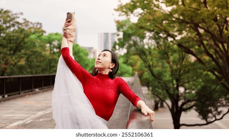 Woman, exercise and ballet stretching in nature, outdoor and practice performance in park. Female person, professional dancer and creative talent in Japan, rehearsal and urban garden for elegant art - Powered by Shutterstock