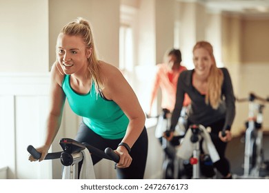 Woman, exercise bike and coach at gym, training and cycling for fitness or spin class. Female person, riding and stationary machine for workout challenge, aerobic instructor and equipment for cardio - Powered by Shutterstock