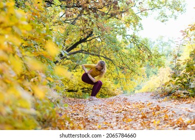 Woman Exercise Yoga Balance Posture With Namaste Hands At Autumn Forest Barefoot, Workout In Scenic Nature