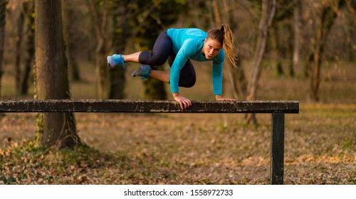 Woman Exercising in the Park. - Powered by Shutterstock