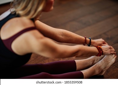 Woman Exercising Yoga At Home.