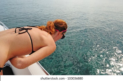 Woman Experiencing Motion Sickness While On A Boat
