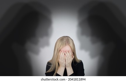 The woman is experiencing a panic attack. The concept of phobia, fears, paranoia and persecution mania. Shadow silhouettes surrounded the man. Nervous breakdown and nervous disorders