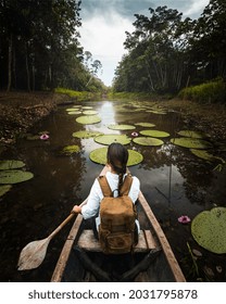 
Woman Explorer Travels An Amazon River In A Canoe