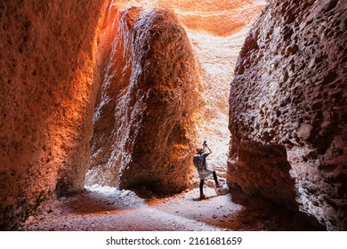 A woman is exploring beautiful echinda chasm and ancient site of Bungle Bungles in Purnululu National Park, Western Australia