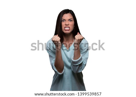 Woman with extreme rage, clinched fists and jaw, angry, emotional, and furious, isolated on white background