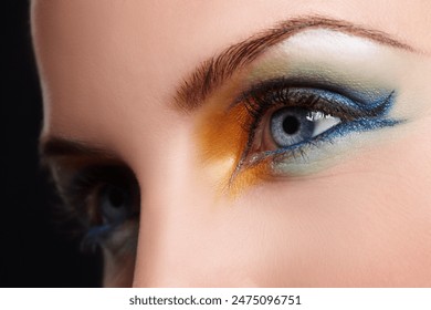 Woman, eyes and eyeshadow in studio, makeup and cosmetics for care on black background. Female person, color and creative skincare or foundation, art glam and eyebrow treatment or dermatology shine