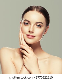 Woman face beauty hand touching   healthy skin natural makeup beautiful female gray background - Shutterstock ID 1770322610