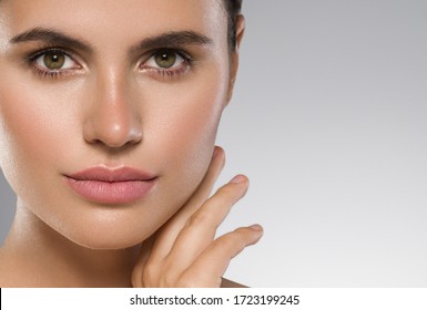 Woman face close up beauty macro eyes lips skin tone