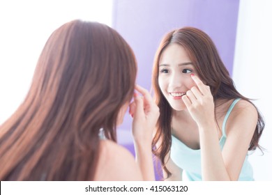 Woman Face And Eye Care And She Touch Eye With Hands, She Look Mirror. Asian Beauty