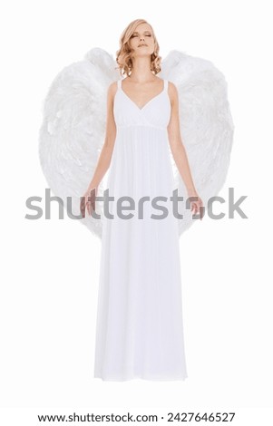 Woman, face and fantasy in studio with angel wings for halloween dress up, celestial fashion or confidence. Model, person and beauty with heavenly costume, relax or natural makeup on white background