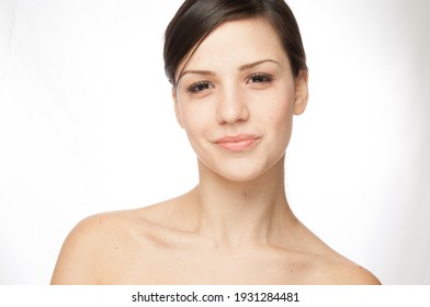 Woman Face With Hair Motion On White Background Isolated Close Up Portrait. Bare Shoulder Of Beautiful Sexy Young Woman With Very Nice Hair Over Simple White Background, Smooth Hand, Woman Face