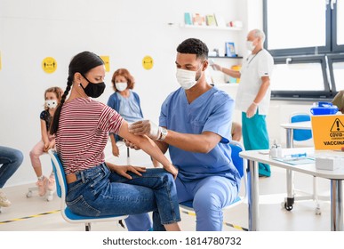 Woman With Face Mask Getting Vaccinated, Coronavirus, Covid-19 And Vaccination Concept.