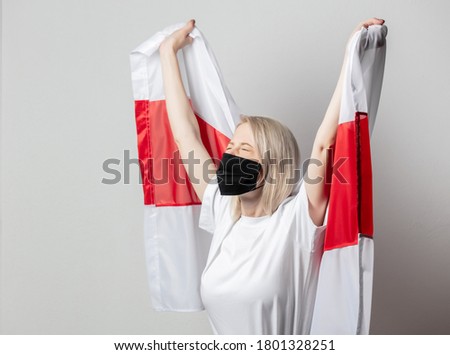 woman in face mask with national Belarus flag on white background