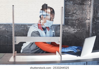 Woman, face mask and typing on laptop at reception for gym compliance, fitness safety and sports schedule. Girl, digital and health checklist, terms and conditions and review policy of covid 19 virus - Powered by Shutterstock