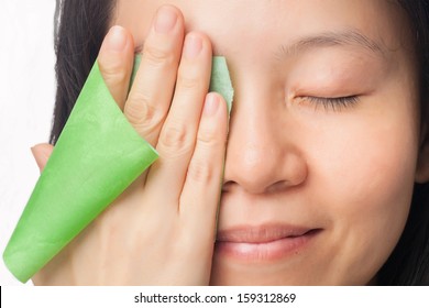 Woman Face With Oily Skin Removing Oil