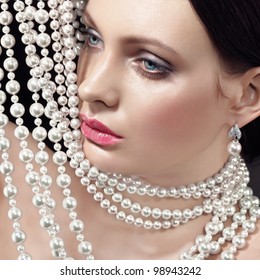 woman face and pearls