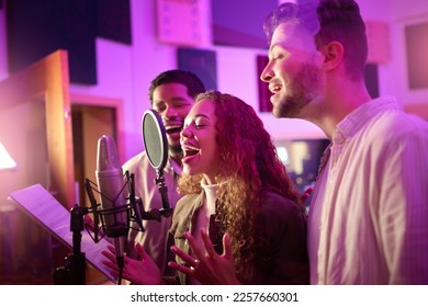 Woman, face or singing group on neon studio microphone in backup singers album, song lyrics or radio recording. Artist, musician or friends in production sound, voice media or light label performance