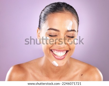 Woman face, skincare and beauty cream for dermatology, health and wellness of natural glow skin on purple background. Headshot of happy cosmetic model laughing in studio with sunscreen product