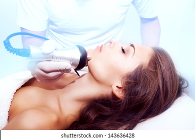 Woman Face Treatment In Medical Spa Center