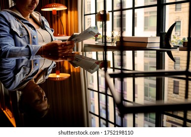 Woman In Fancy Hotel Reading City Map 