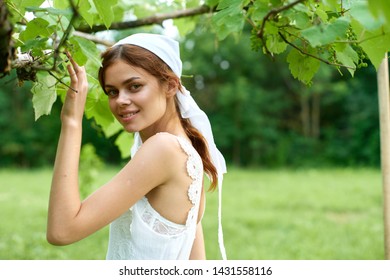 Woman Farmer At The Cottage In A Scarf Summer