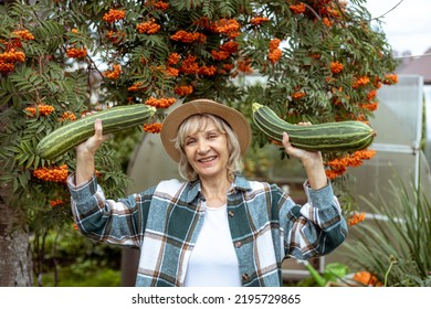 Woman Farmer Proud Of Zucchini Harvest