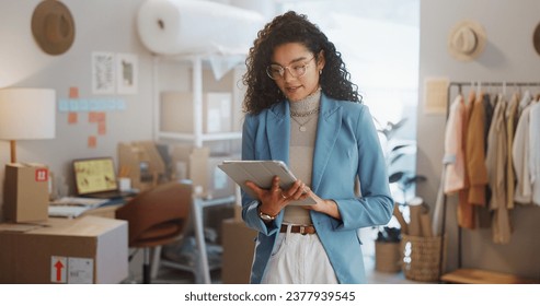 Woman, fashion designer and tablet in logistics, research or small business management at boutique. Female person or entrepreneur working on technology for inventory or storage check at retail store - Powered by Shutterstock