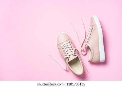 Woman fashion pink shoes on pink background. Top view copy space.