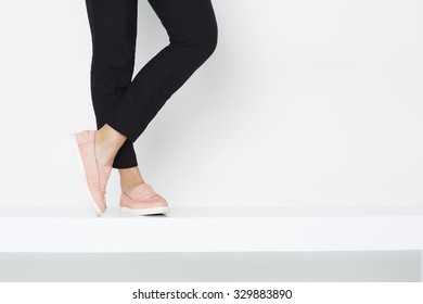 Woman In Fashionable Trousers And Loafers