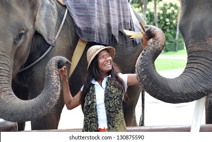 Woman Feeding The Elephants