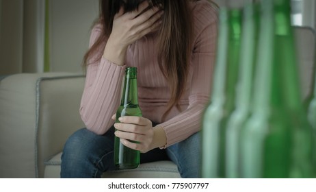 woman feel depression and alcoholism in the home - Shutterstock ID 775907797