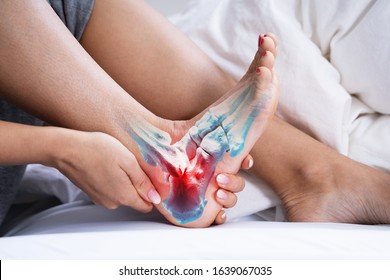 Woman Feeling Achilles Heel Pain In Bed