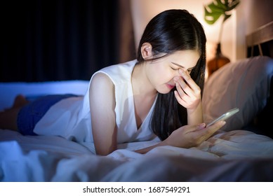 Woman Is Feeling Eye Pain When Using Smart Phone At Night