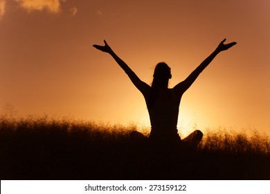 Woman feeling free in a beautiful natural setting.