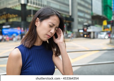 Woman feeling headache