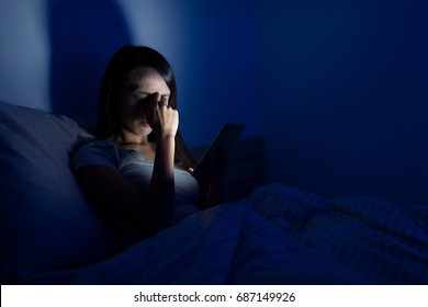 Woman Feeling Headache Bed With Mobile Phone At Night 