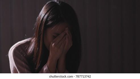 Woman feeling sad in the dark 