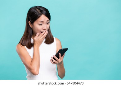 Woman Feeling Shock Reading On Mobile Phone