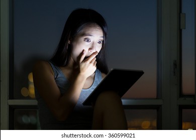 Woman Feeling Shock When Using The Tablet Pc