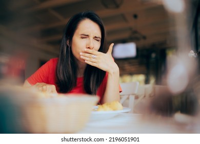 
Woman Feeling Sick And Disgusted By Food Course In A Restaurant. Unhappy Person Having Health Problems After Eating In A Diner
